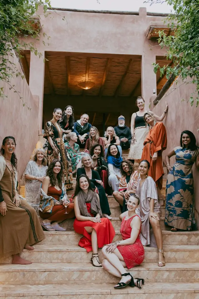 The Rebel community gathered on the terracotta stairs of the retreat house in Morocco
