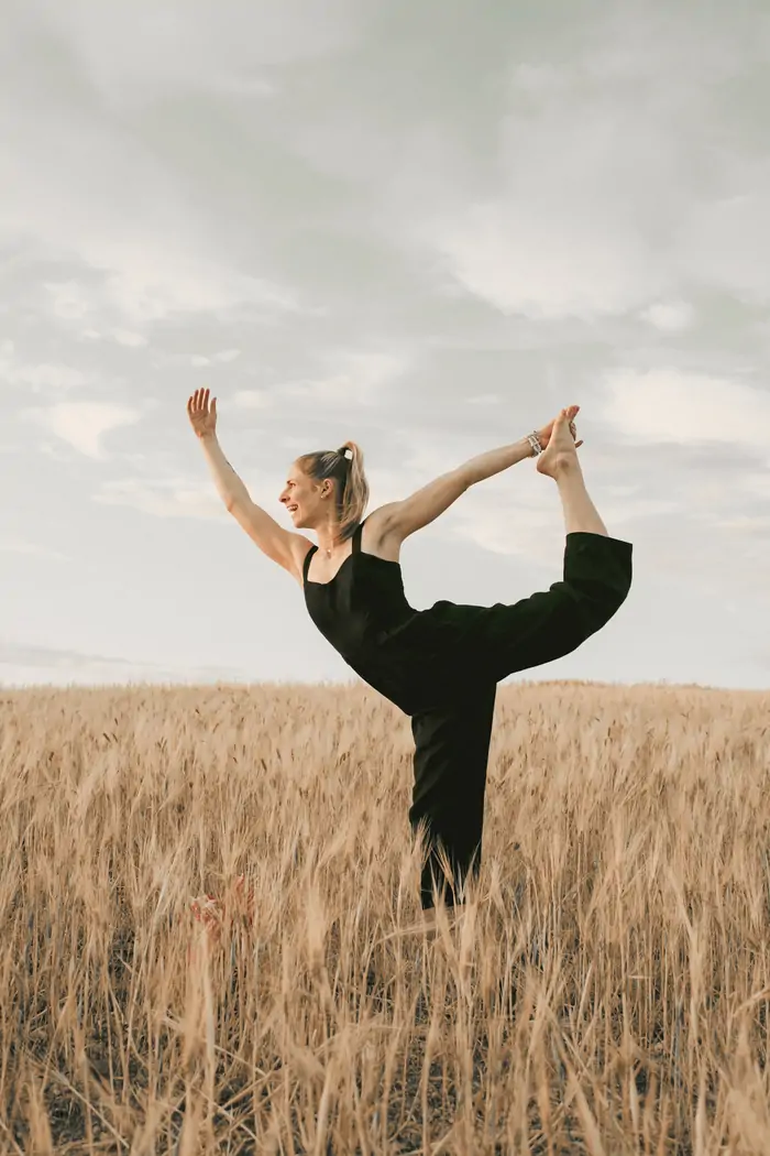 Dancer pose over the golden field