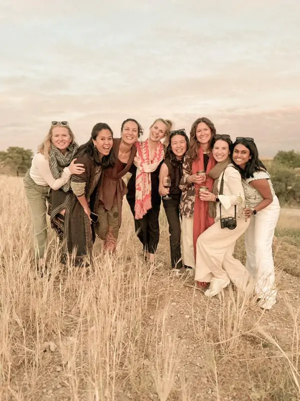 The group together in the golden field at dusk