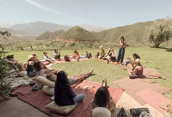 A long picnic on rugs in the green valley