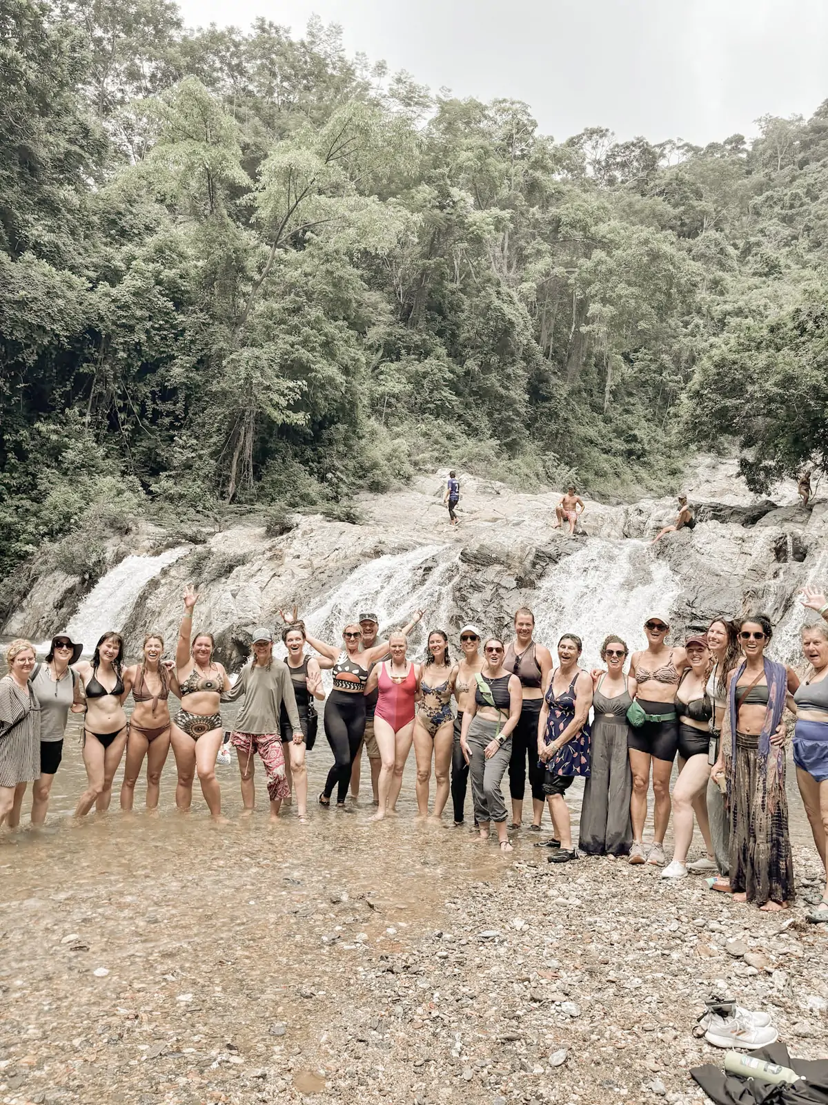 The group together at the waterfall in the Atlantic Forest