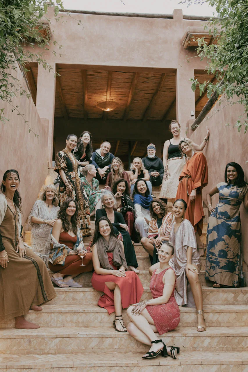 The Rebel circle together on the steps at a past retreat