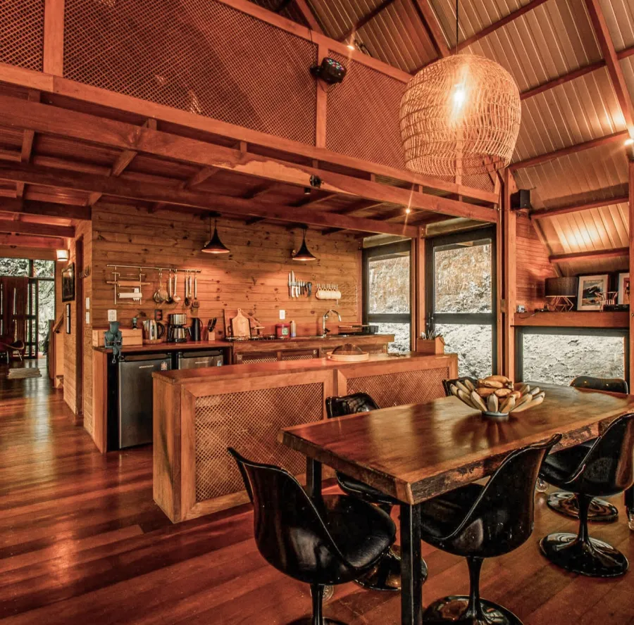 The kitchen and dining space of a forest villa